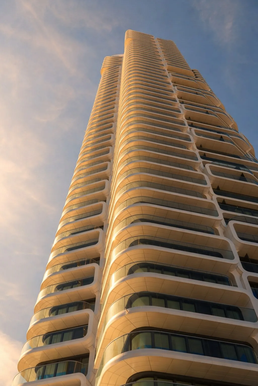 Grand Tower Frankfurt — vertical portrait of the honeycomb façade, hundreds of precast hexagonal balcony modules stacked against the sky